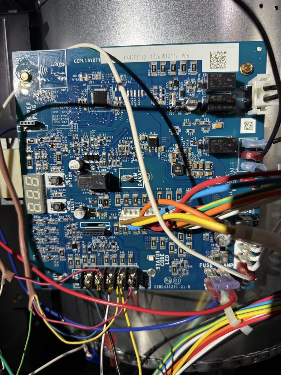 Furnace control board with its status display and wiring harnesses
